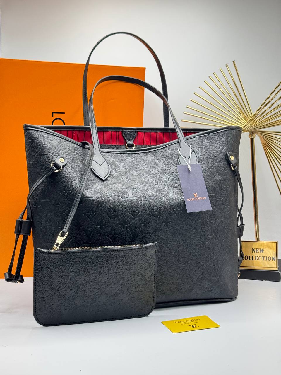 Louis Vuitton Neverfull MM μαύρη Monogram Empreinte με κόκκινη επένδυση και νεσεσέρ